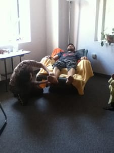 patient relaxes in easyboy chair while getting acupuncture